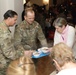 3rd Infantry Division Artillery Soldiers carol and serve food at Latvian church