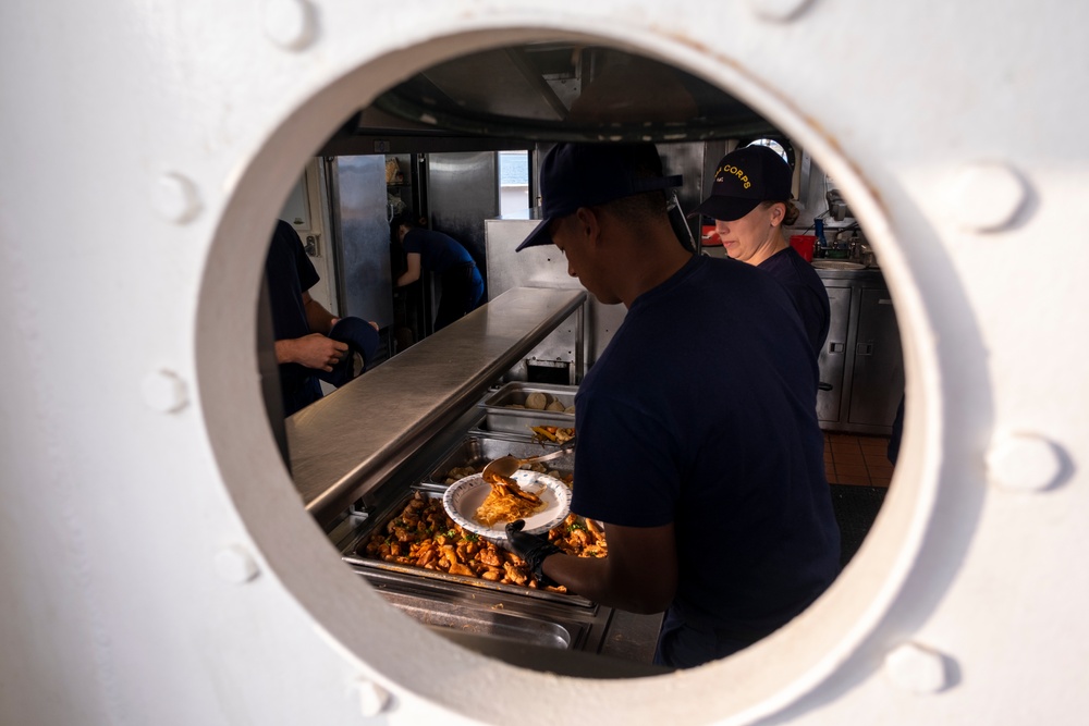 Officer candidates aboard CGC Barque Eagle prepare lunch for crew