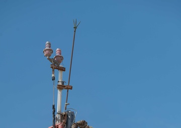 Weather and Engineering Installation Airmen perform maintenance on a weather sensor