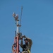 Weather and Engineering Installation Airmen perform maintenance on a weather sensor