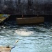 Construction crew lowers material to divers as they repair the USACE Chicago Harbor Lock floor
