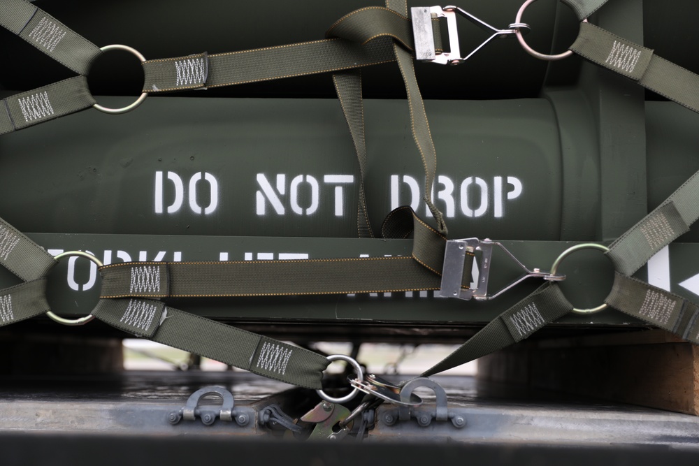 Airmen from the 87th and 721st Aerial Port Squadrons move explosive cargo at Ramstein Air Base, Germany