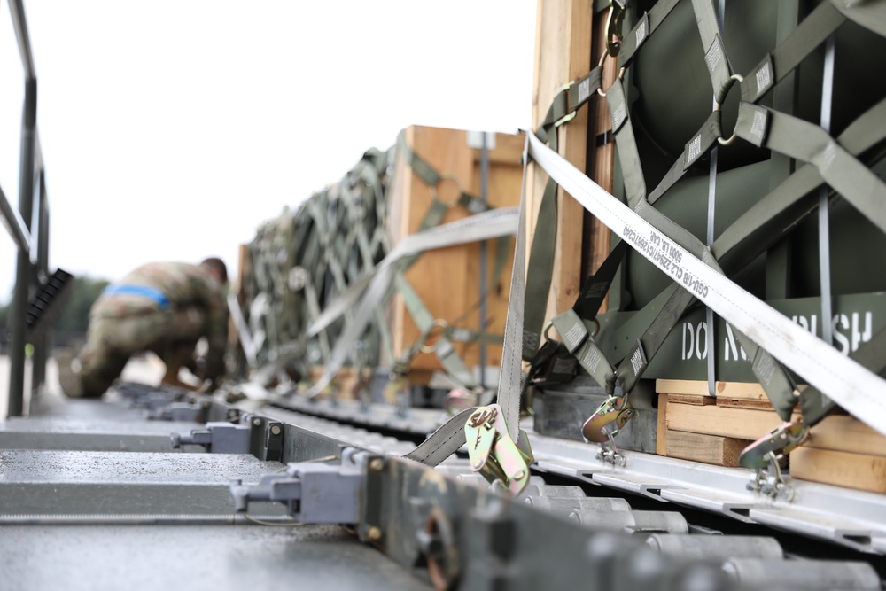 Airmen from the 87th and 721st Aerial Port Squadrons move explosive cargo at Ramstein Air Base, Germany