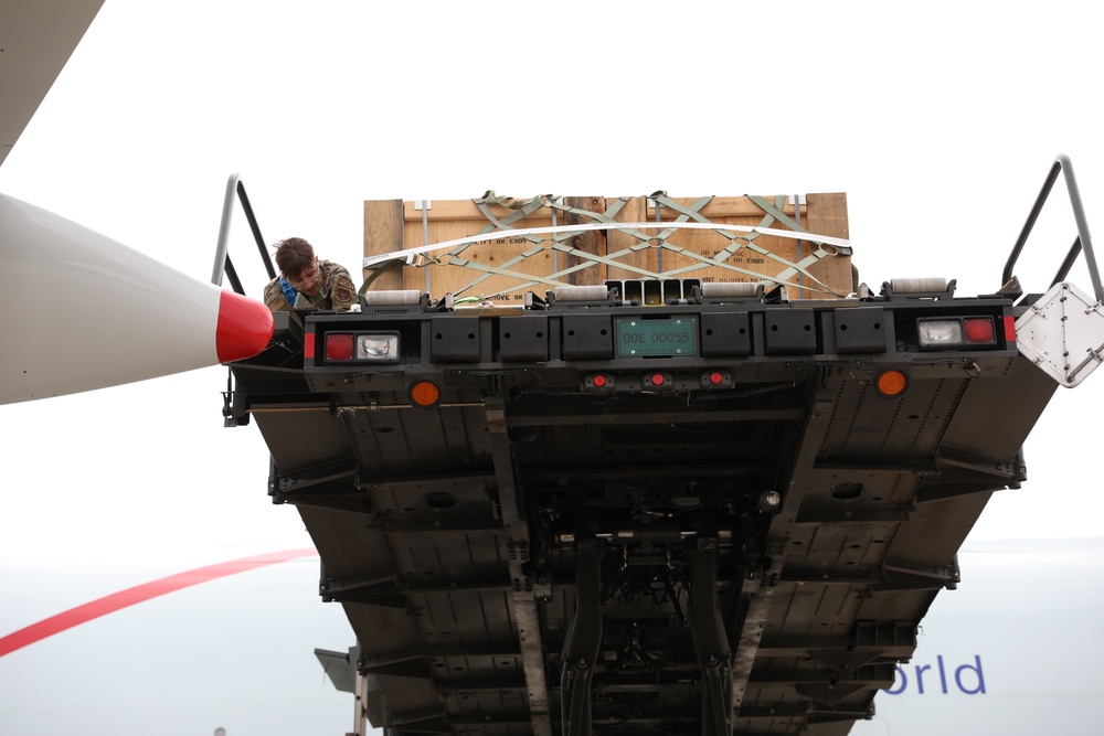 Airmen from the 87th and 721st Aerial Port Squadrons move explosive cargo at Ramstein Air Base, Germany
