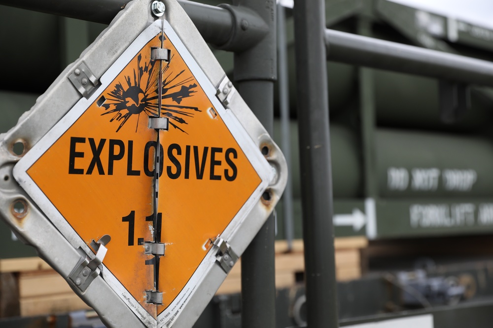 Airmen from the 87th and 721st Aerial Port Squadrons move explosive cargo at Ramstein Air Base, Germany