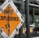 Airmen from the 87th and 721st Aerial Port Squadrons move explosive cargo at Ramstein Air Base, Germany