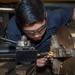 USS Ronald Reagan (CVN 76) Sailors conduct machine repairs and installations