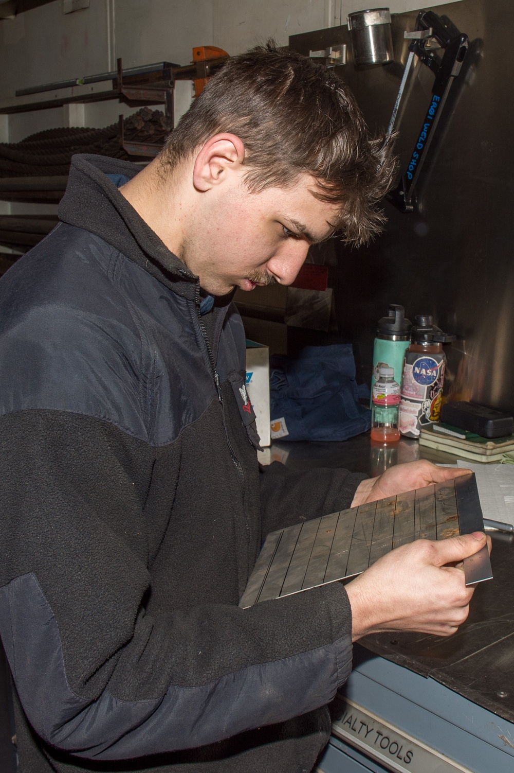 USS Ronald Reagan (CVN 76) Sailors conduct machine repairs and installations