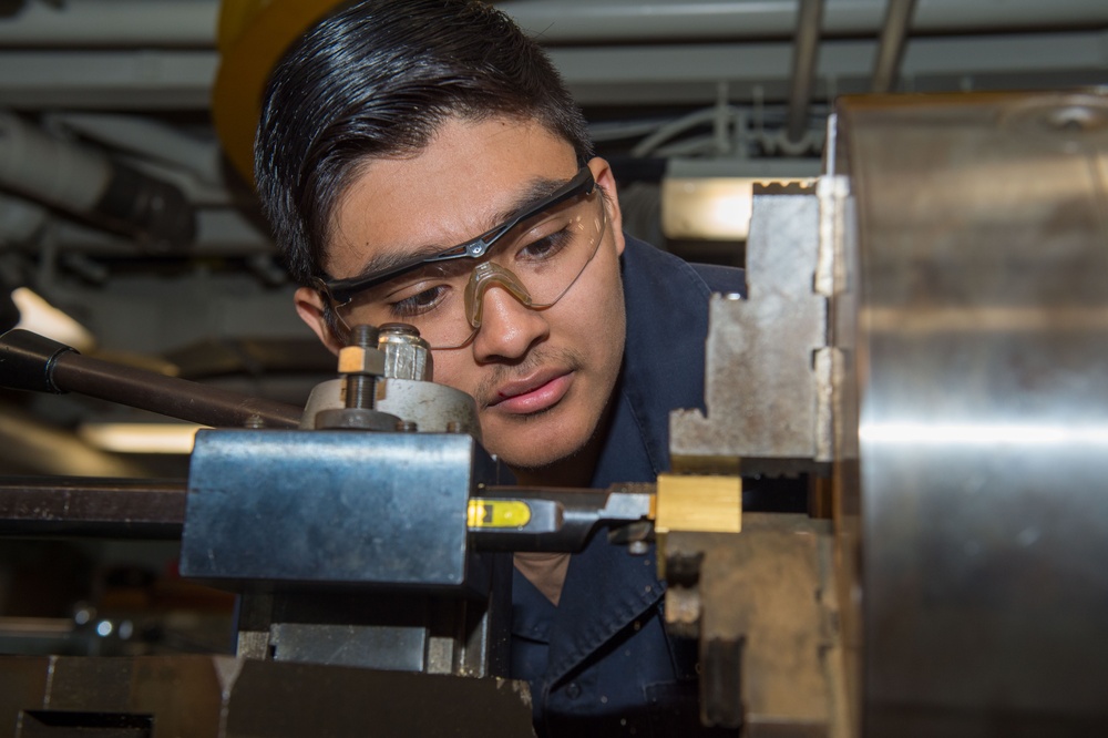USS Ronald Reagan (CVN 76) Sailors conduct machine repairs and installations