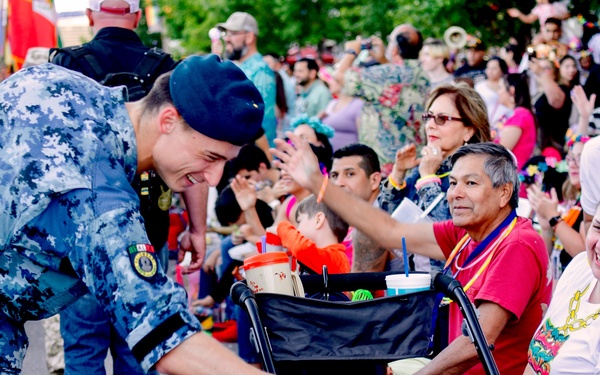 Fiesta Flambeau lights up San Antonio sky, as DLIELC students march in annual parade