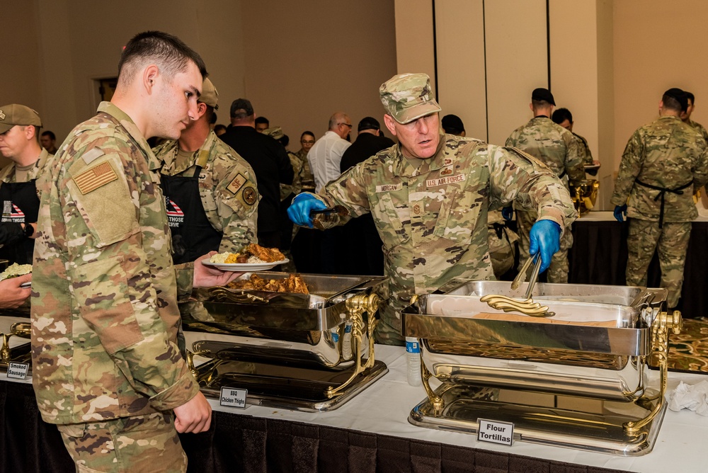 Chief serves up dinner along side Chef