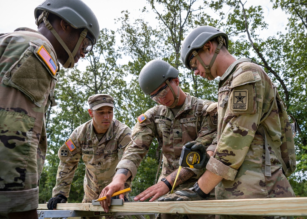 Soldiers in training learn combat construction skills.