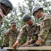 Soldiers in training learn combat construction skills.