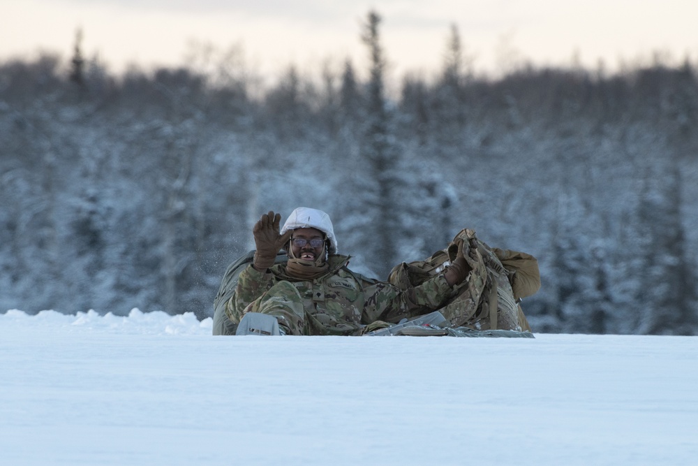 Army paratroopers and Marine Corps aviators conduct joint airborne training at JBER