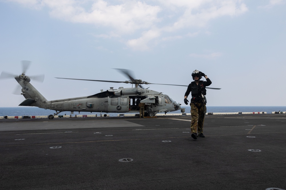 HSC 26 Air Crewman Transits the USS Bataan's Flight Deck