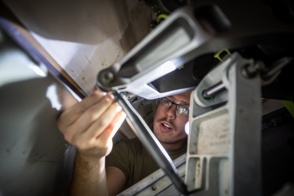 932nd AW crew chiefs perform routine inspection on C-40C