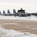139th members remove snow from flightline, aircraft