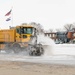 139th members remove snow from flightline, aircraft