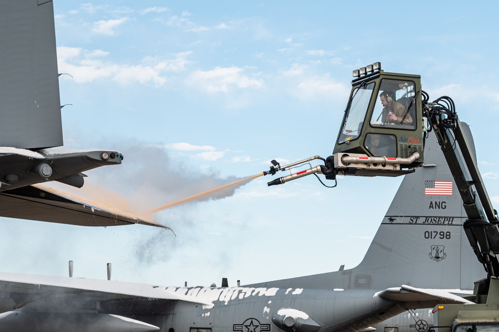 139th members remove snow from flightline, aircraft