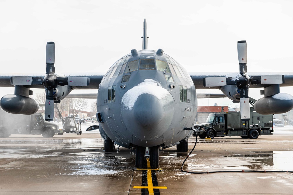 139th members remove snow from flightline, aircraft