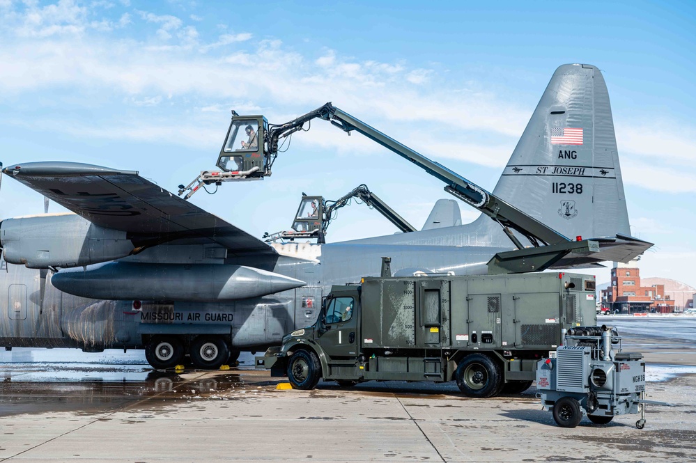 139th members remove snow from flightline, aircraft