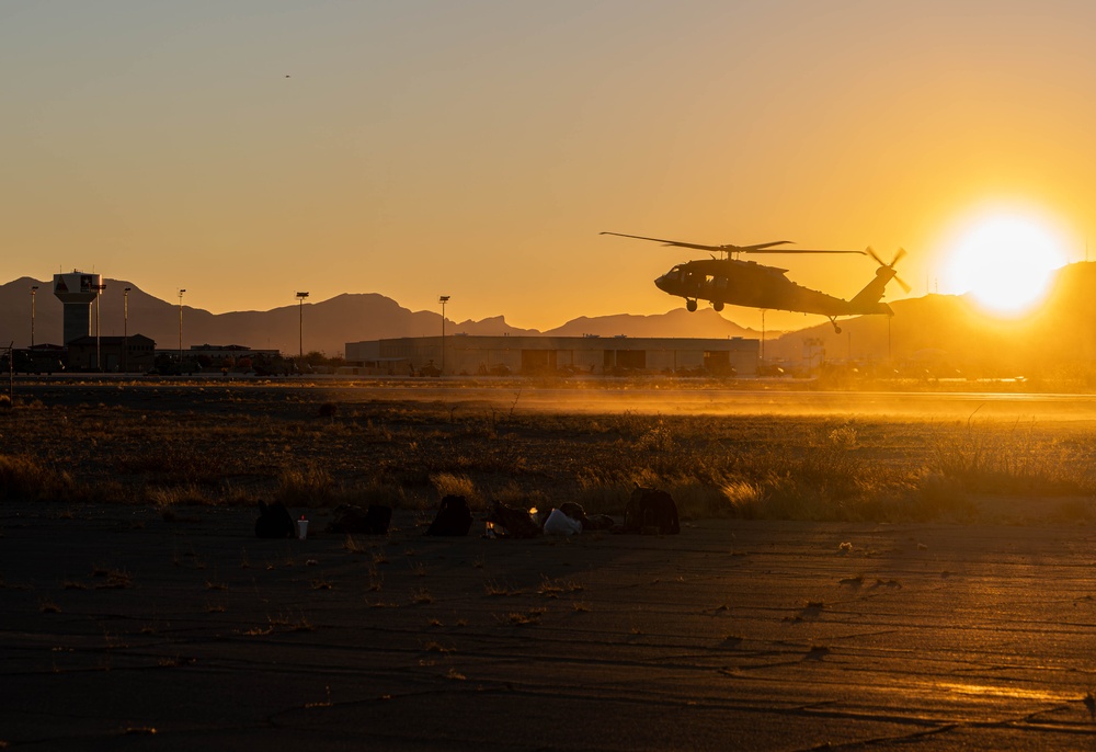 UH-60M Black Hawk lands at airfield during sunset