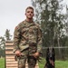 8th Military Police Brigade working dog handler and military working dog, pose for a photo on Scofield Barracks.