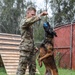 8th Military Police Brigade working dog handler and military working dog, pose for a photo on Scofield Barracks.