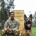 8th Military Police Brigade working dog handler and military working dog, pose for a photo on Scofield Barracks.