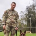 8th Military Police Brigade working dog handler and military working dog, pose for a photo on Scofield Barracks.