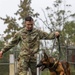 8th Military Police Brigade working dog handler and military working dog, pose for a photo on Scofield Barracks.