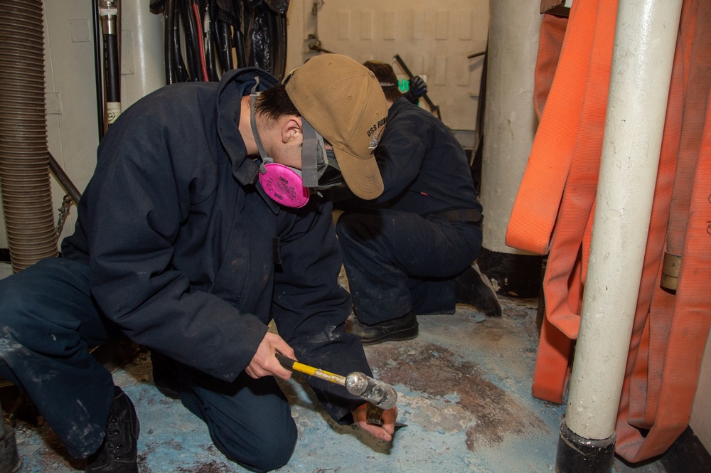 USS Ronald Reagan (CVN 76) Sailors conduct deck demolition