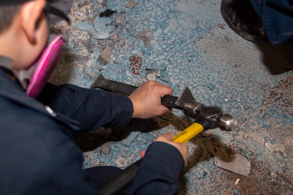 USS Ronald Reagan (CVN 76) Sailors conduct deck demolition