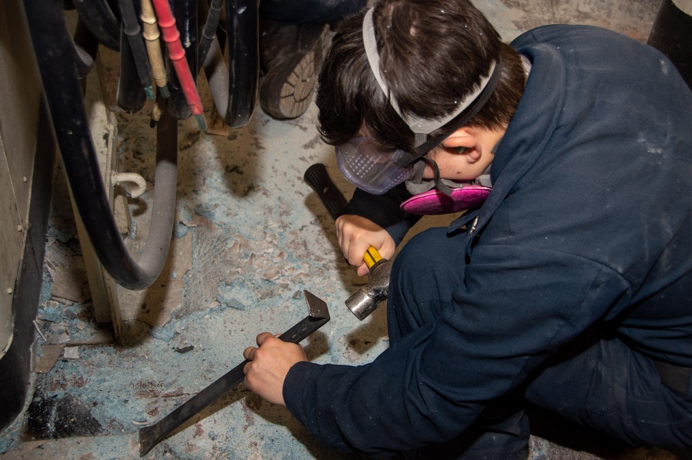 USS Ronald Reagan (CVN 76) Sailors conduct deck demolition