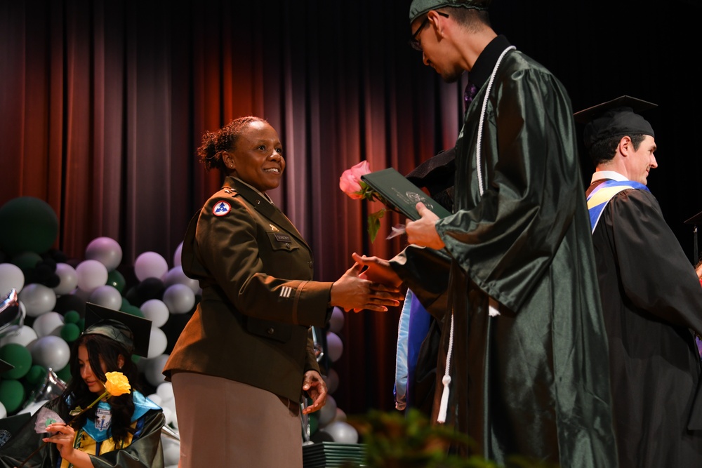 Brig. Gen. Tomika Seaberry congratulating Steinmetz College Prep graduates