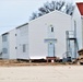 Contractors finish moving World War II-era barracks buildings to new foundations at Fort McCoy