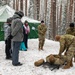 3rd Infantry Division Artillery medics provide first-aid training to children at Latvian winter camp