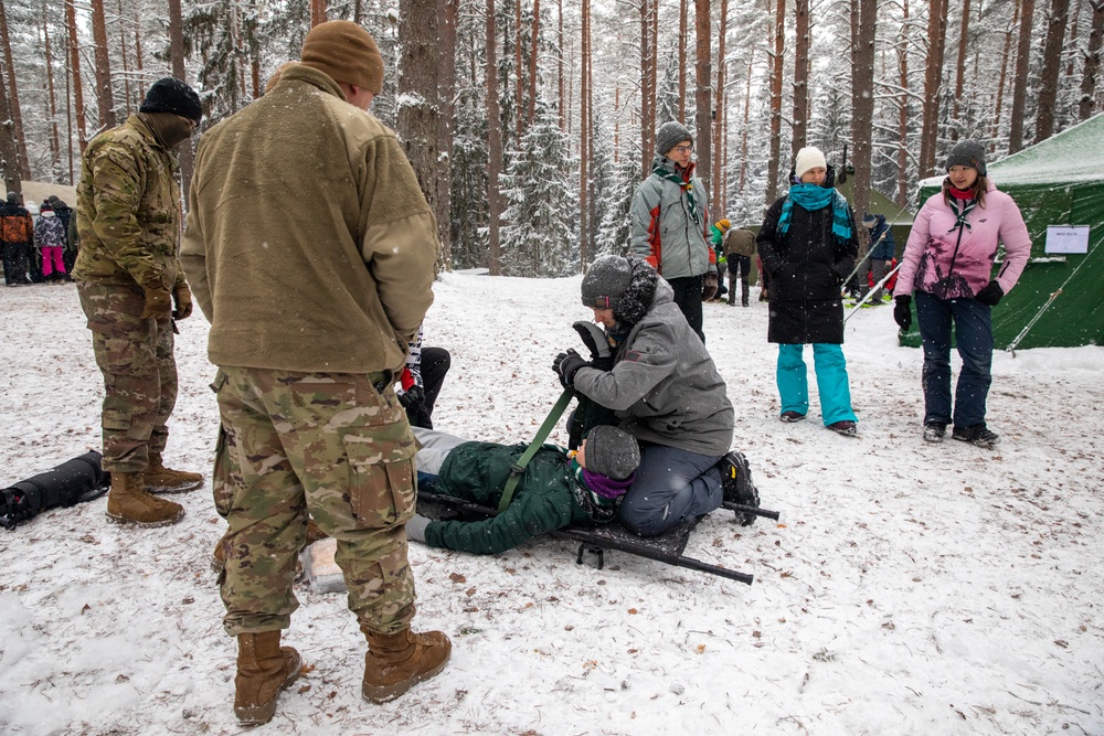 3rd Infantry Division Artillery medics provide first-aid training to children at Latvian winter camp