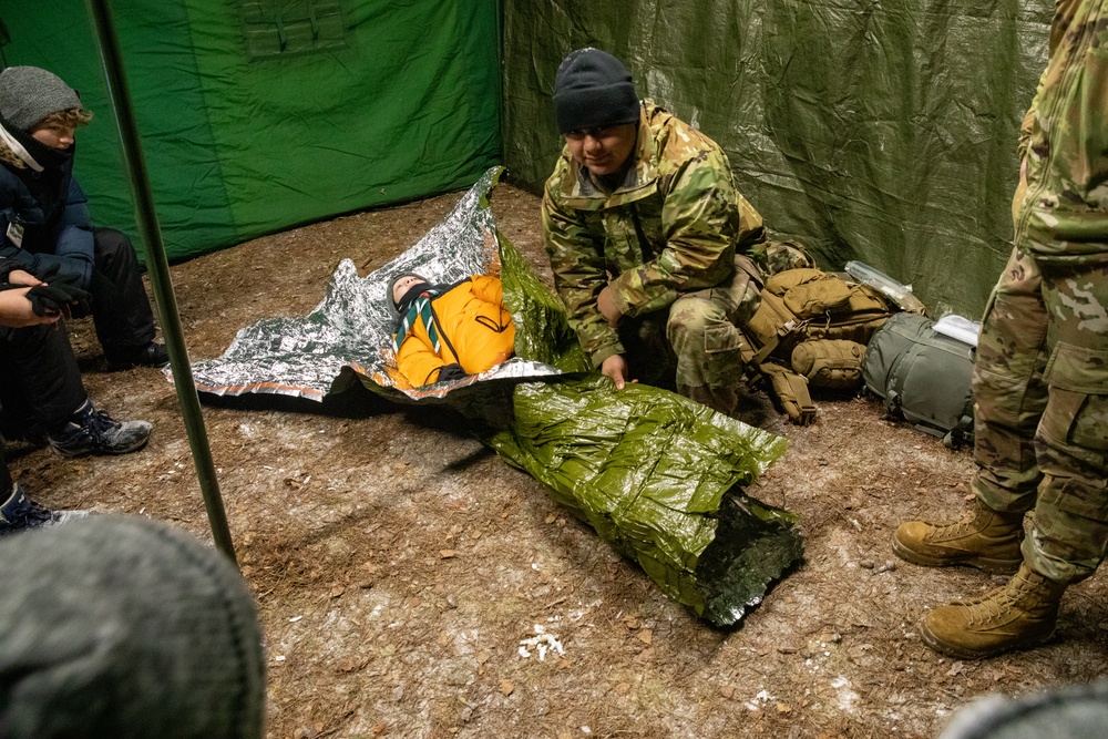 3rd Infantry Division Artillery medics provide first-aid training to children at Latvian winter camp