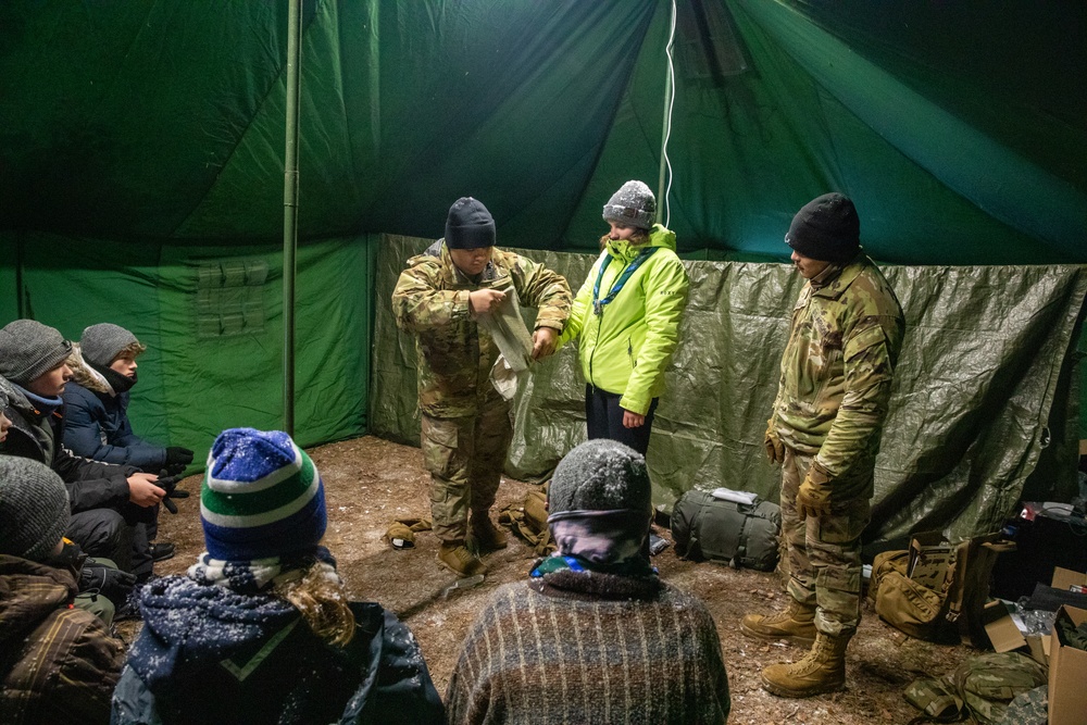 3rd Infantry Division Artillery medics provide first-aid training to children at Latvian winter camp