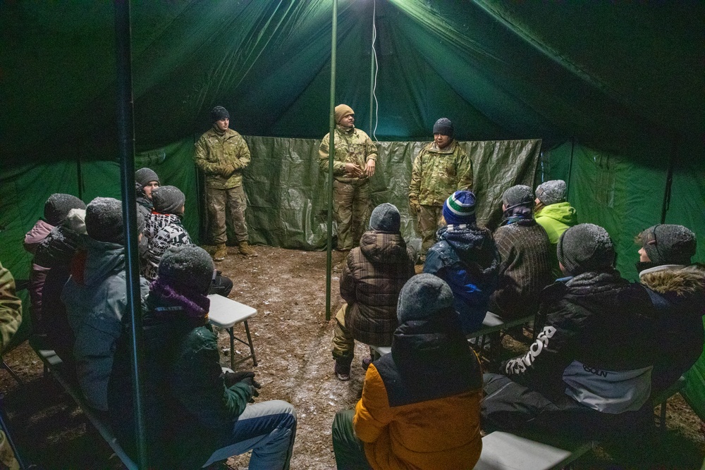 3rd Infantry Division Artillery medics provide first-aid training to children at Latvian winter camp