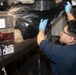 USS Bataan Sailors Sort Trash