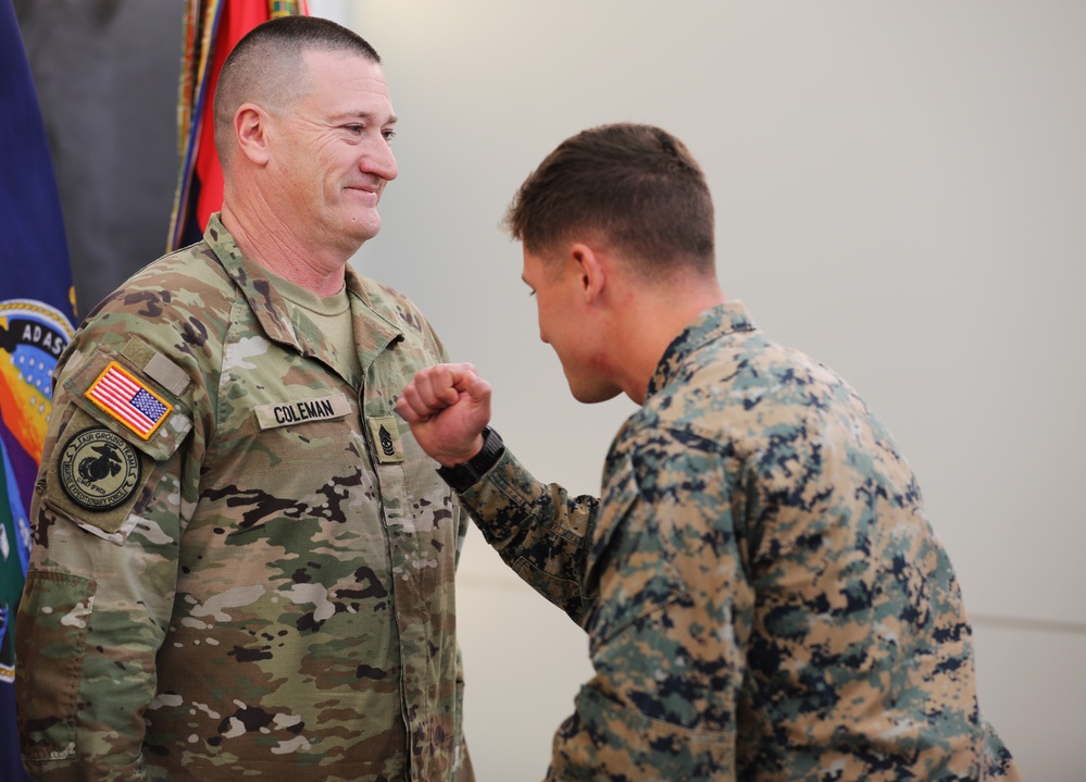 Sgt. Maj. Coleman of the 35th ID promoted by his sons