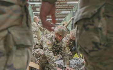 U.S. Army Reserve Soldier opens a liter during Combat Lifesaver Course