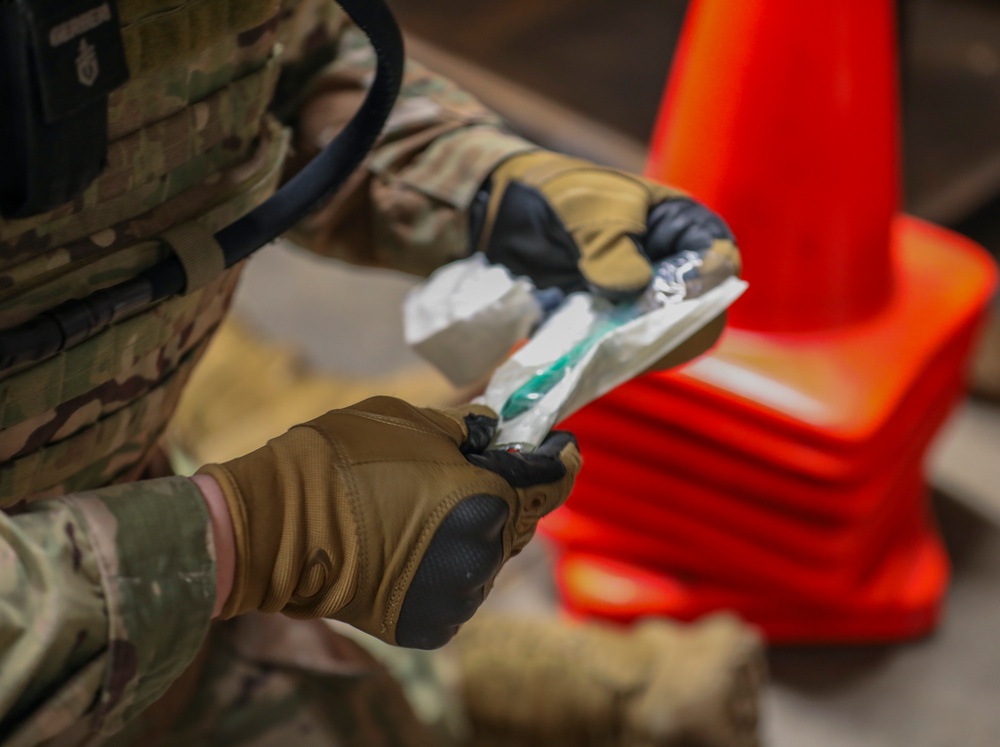 U.S. Army Reserve Soldier prepares a Nasopharyngeal Airway during Combat Lifesaver Course