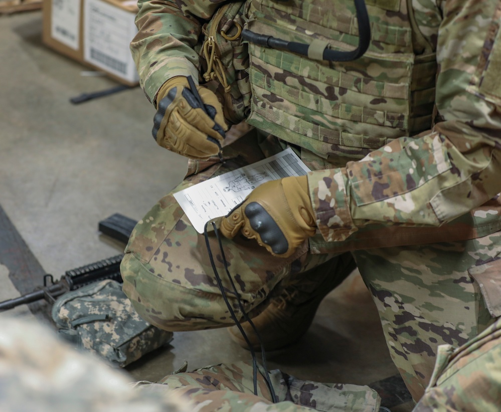 U.S. Army Reserve Soldier fills out Tactical Combat Casualty Care card during Combat Lifesaver Course