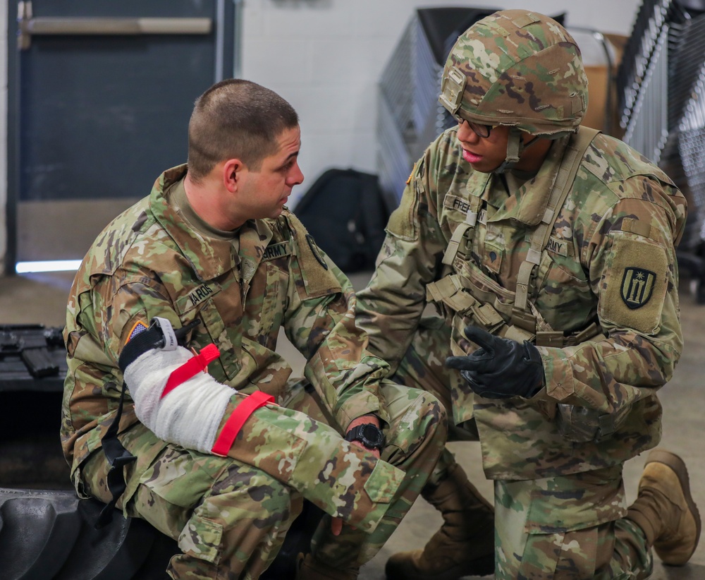 U.S. Army Reserve Soldier checks on casualty during Combat Lifesaver Course
