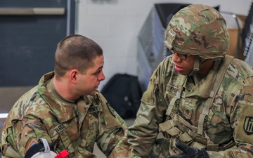U.S. Army Reserve Soldier checks on casualty during Combat Lifesaver Course