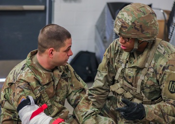 U.S. Army Reserve Soldier checks on casualty during Combat Lifesaver Course