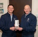 Lt. Gen. Michael Schmidt presents the defense meritorious service medal to Lt. Col. Eric Suits at the Eisenhower School